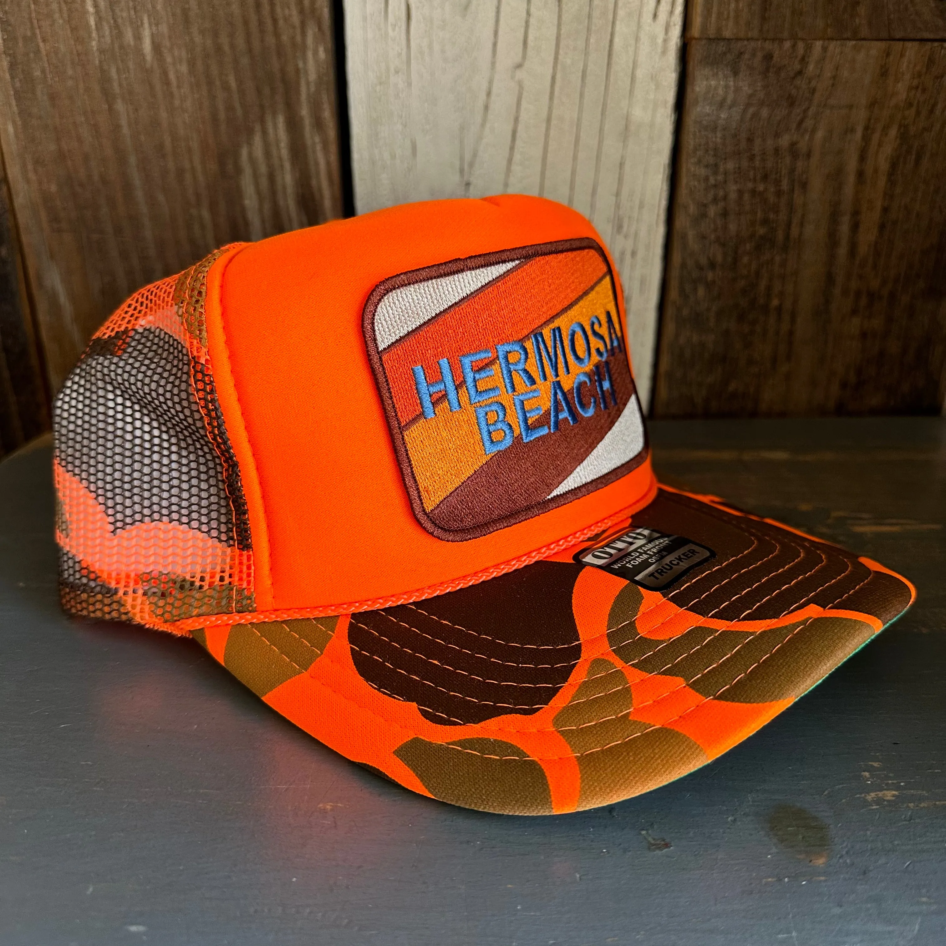Hermosa Beach GOLF CARTS & YOGA PANTS High Crown Trucker Hat - Neon Orange Hunters Camo